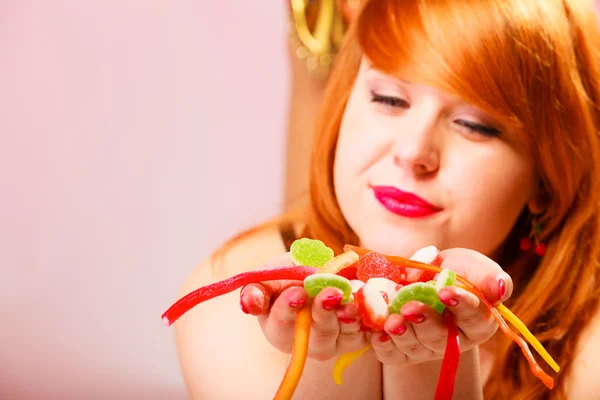 Woman holding sweets — Stock Photo, Image