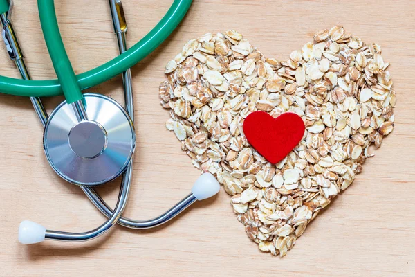 Oat flakes  and stethoscope. — Stock Photo, Image