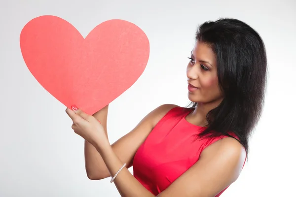 Girl holding paper red heart — Stock Photo, Image