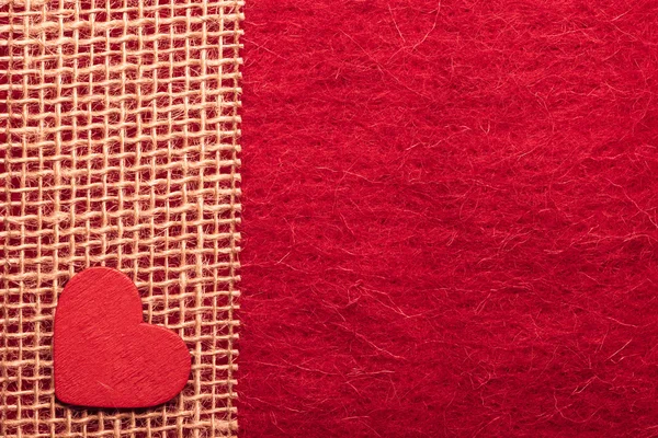 Heart on red cloth background — Stock Photo, Image