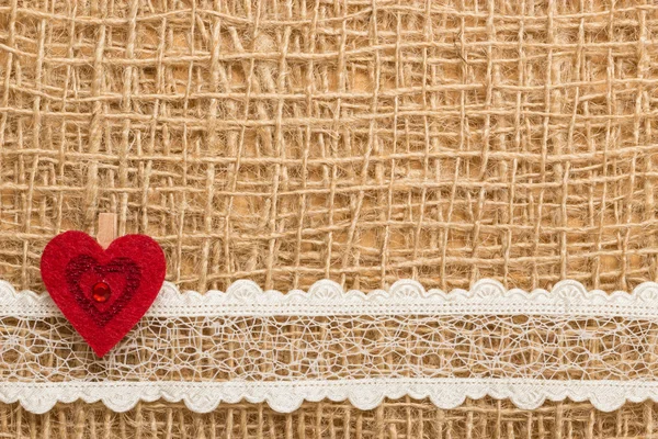Red heart on cloth — Stock Photo, Image