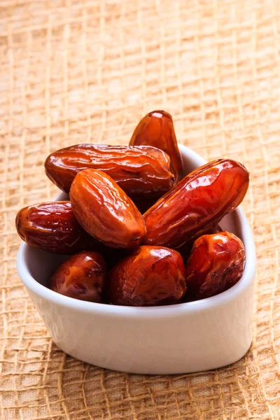 Dried dates in bowl — Stock Photo, Image