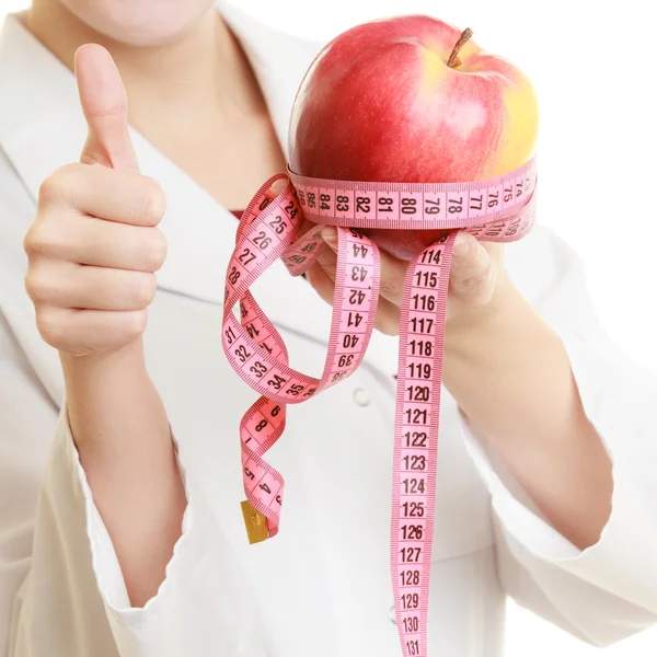 Doctor  holding apple — Stock Photo, Image