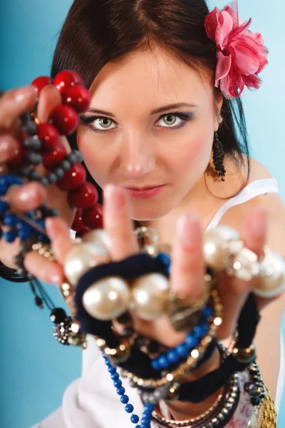 Summer girl with plenty of jewellery, beads in hands — Stock Photo, Image