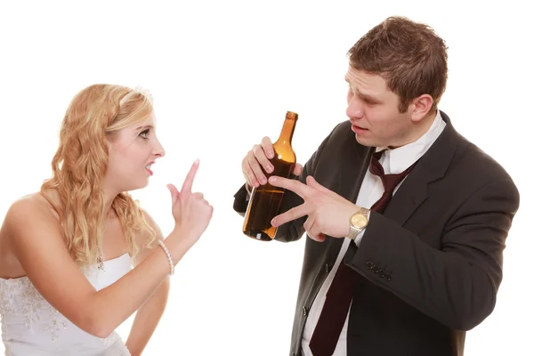 Wedding couple, bride with alcoholic drinking groom. — Stock Photo, Image
