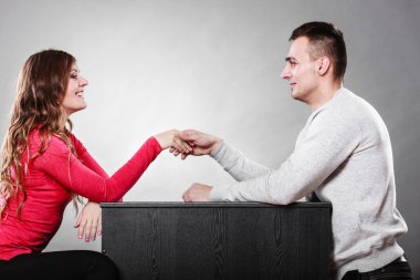 Male and female shaking hands clipart