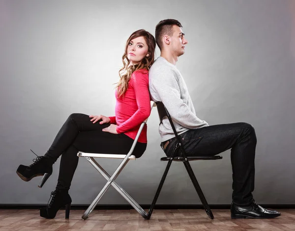 Unhappy couple sitting back to back. Disagreement. — Stock Photo, Image