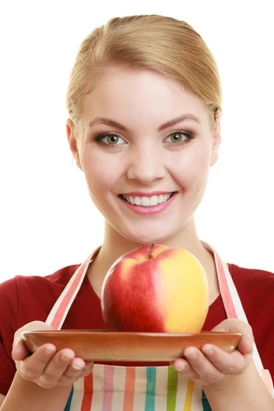 Housewife offering apple Stock Photo