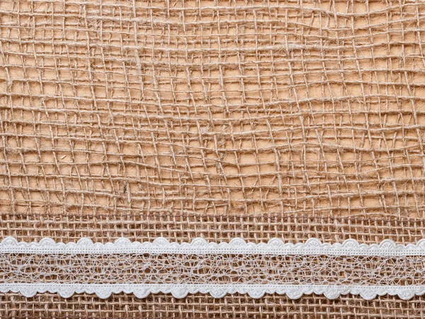 Ribbon on burlap cloth — Stock Photo, Image