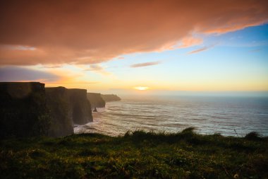 Cliffs of Moher at sunset in Co. Clare Ireland Europe. clipart
