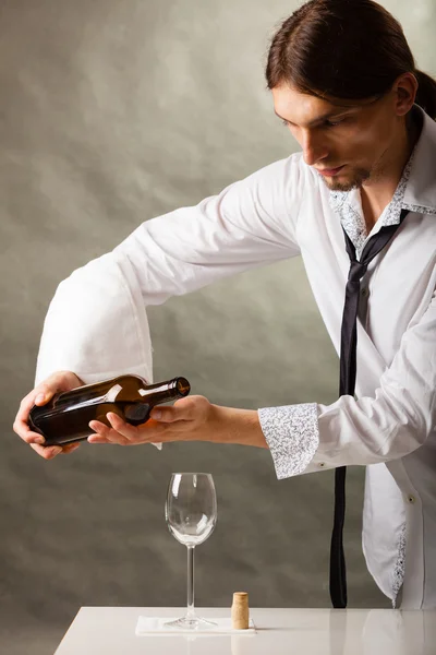 Man waiter pouring wine into glass. — Stock Photo, Image