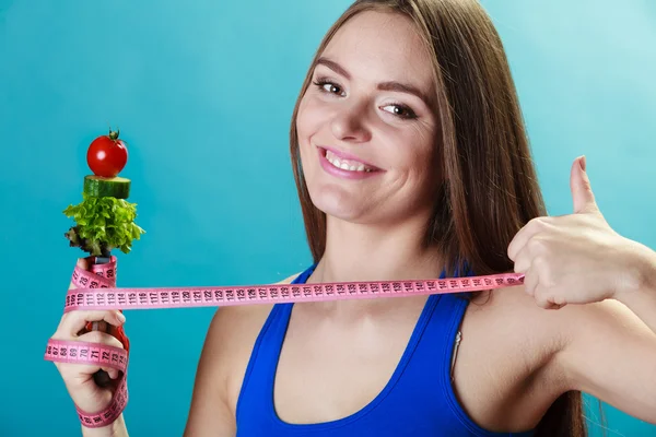 Woman holding fork with vegetables — Stock Photo, Image