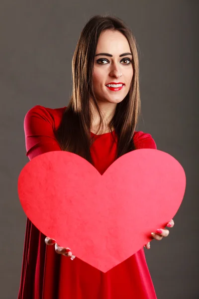 Woman holding big heart love symbol — Stock Photo, Image