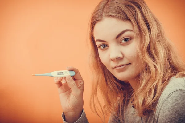 Woman holding  digital thermometer — Stock Photo, Image