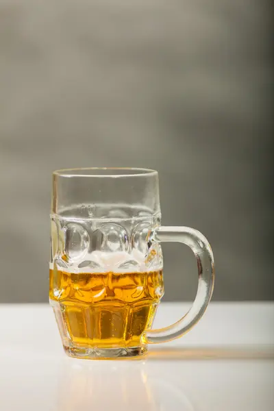 Golden beer on table — Stock Photo, Image