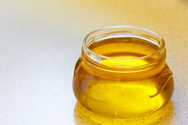 Jar of organic floral honey — Stock Photo, Image