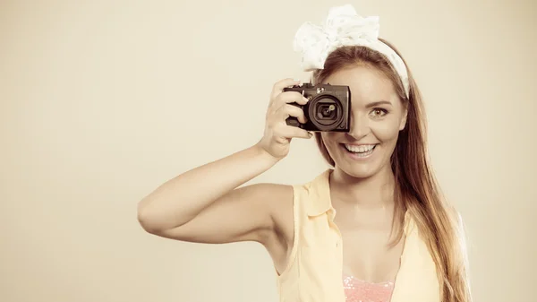 Girl with hairband bow taking photo — Stock Photo, Image