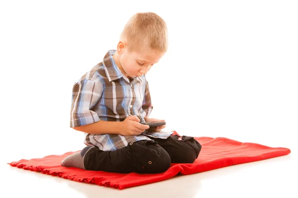 Boy with smartphone playing games — Stock Photo, Image