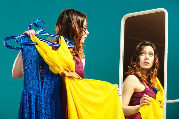 Woman choosing clothing. — Stock Photo, Image