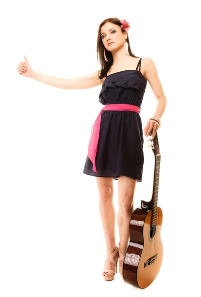 Girl  with acoustic guitar thumbing — Stock Photo, Image