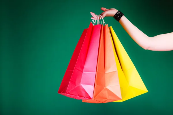 Woman hand with shopping bags. — Stock Photo, Image