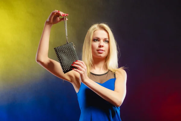 Elegant woman holds black handbag — Stock Photo, Image