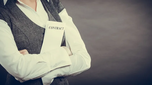 Businesswoman holding contract in hands — Stock Photo, Image