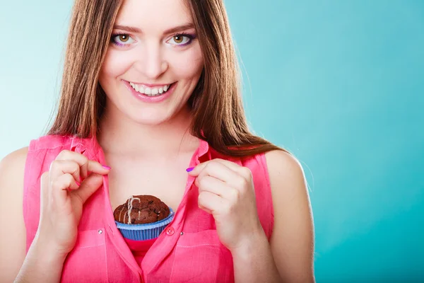Woman holding chocolate cake on chest — Stock Photo, Image