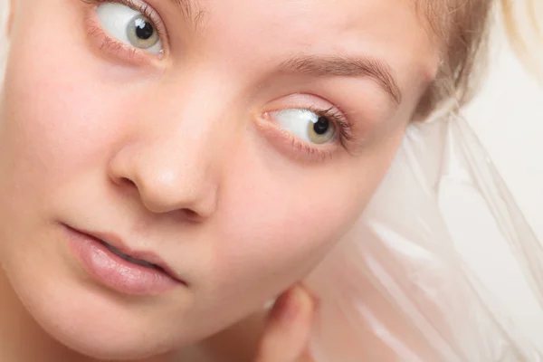 Girl removing facial peel off mask — Stock Photo, Image