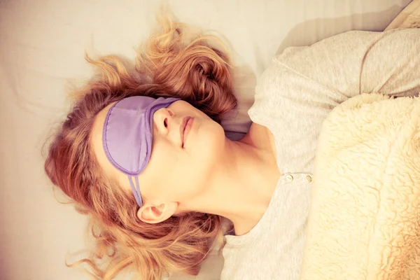 Tired woman sleeping in bed — Stock Photo, Image