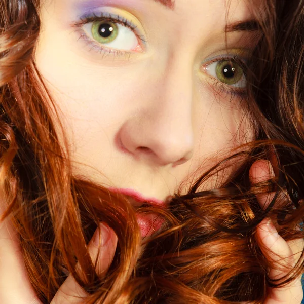 Girl with long curly red hair posing — Stok fotoğraf