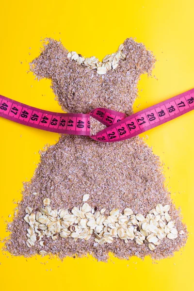 Dress shape made from cereal bran — Stock Photo, Image