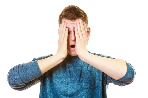 Stressed man holding head with hands — Stockfoto