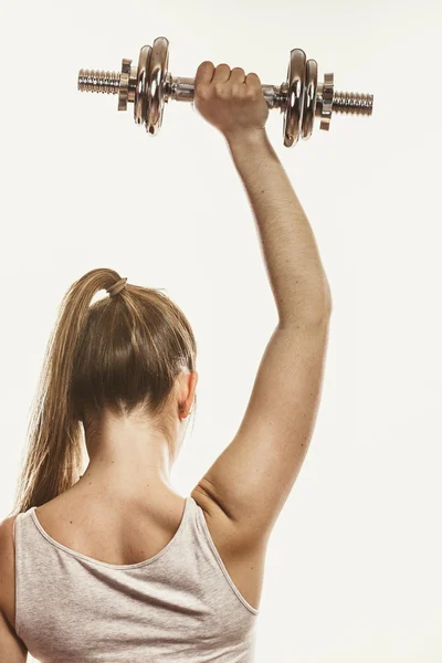 Mulher levantando haltere — Fotografia de Stock