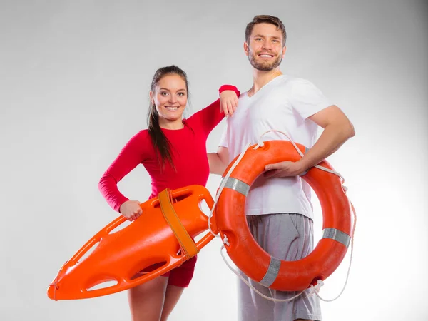 Lifeguard couple with rescue equipment — Stock Photo, Image