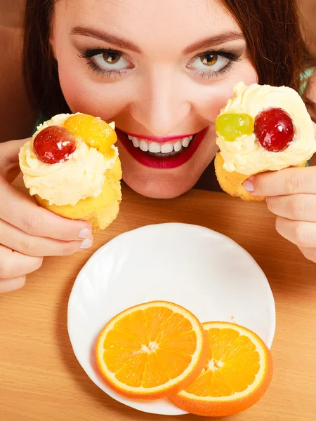 Woman taking delicious sweet cake. Gluttony. — Stock Photo, Image