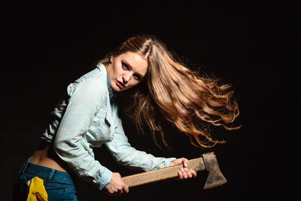 Woman holding axe Royalty Free Stock Photos