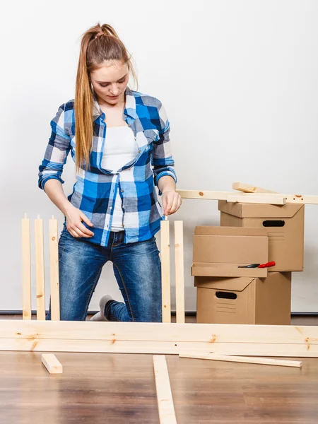 Girl arranging apartment  interior — 스톡 사진