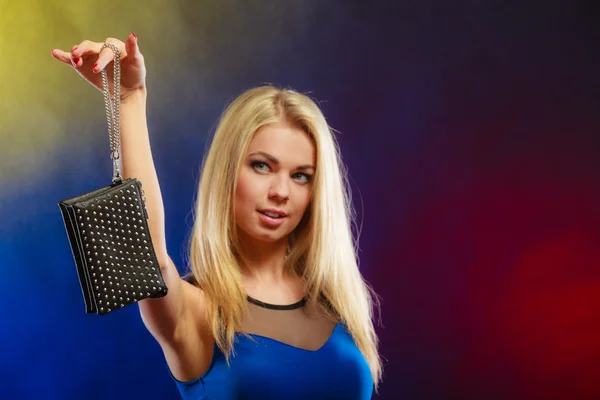 Elegant woman holds black handbag — Stock Photo, Image