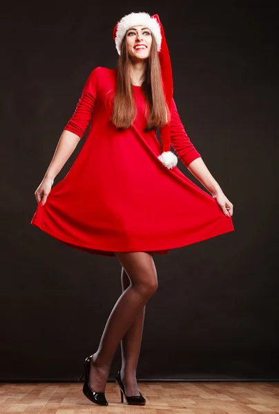 Woman wearing santa claus hat on black — Stock Photo, Image