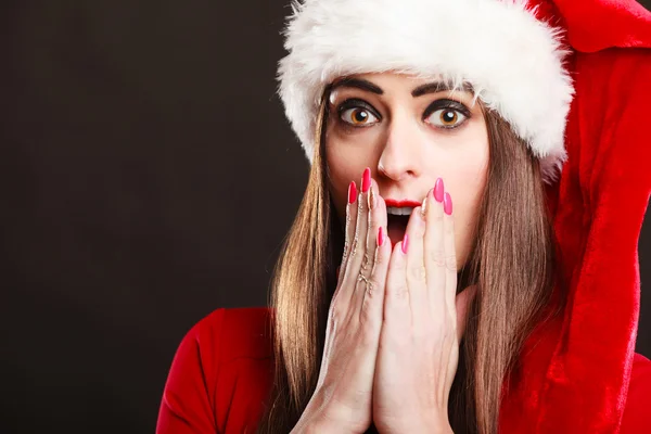 Surprised woman wearing santa claus hat — Stock Photo, Image