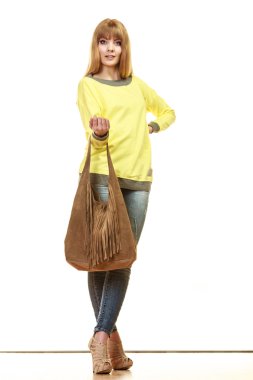 Woman holding  brown handbag clipart