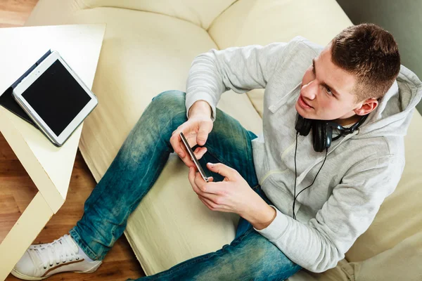 Man relaxing on couch — Stock Photo, Image