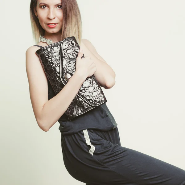 Girl holding black bag — Stock Photo, Image