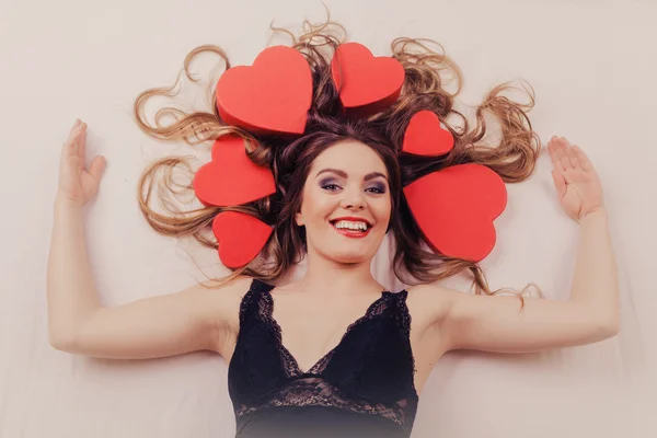 Girl with heart shape boxes — Stock Photo, Image