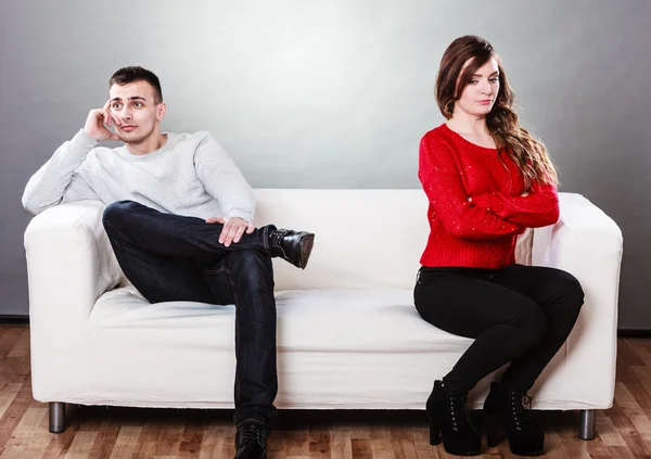 Couple after quarrel sitting on sofa — Stock Photo, Image