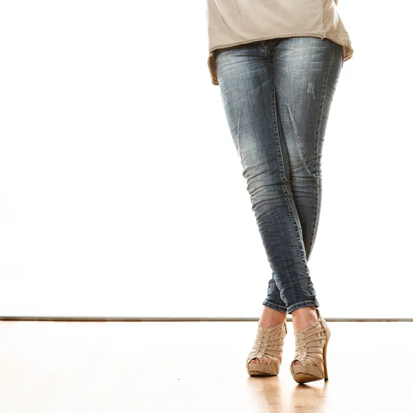 Woman in denim trousers standing — Stock Photo, Image