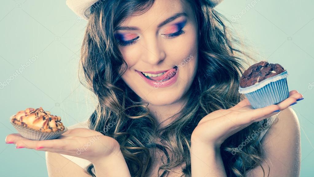 Woman holding cakes Stock Photo by ©Voyagerix 82877184