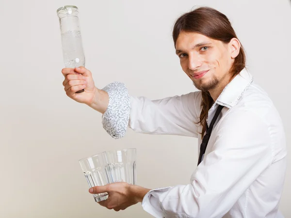 Young man bartender pouring a drink — Stock Photo, Image