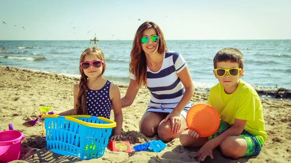 Family  having fun on beach. — Stock Photo, Image
